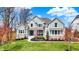 Charming two-story home featuring a well-manicured lawn and inviting front porch at 4410 Miller Way, Westfield, IN 46062