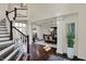 Grand foyer with hardwood floors and staircase leading to the second level at 4410 Miller Way, Westfield, IN 46062