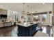 Spacious kitchen with an island, a breakfast table, hardwood floors, and a view of the backyard at 4410 Miller Way, Westfield, IN 46062