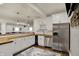 Bright basement kitchen featuring white cabinets, wood countertops, stainless steel appliances, and bar at 4410 Miller Way, Westfield, IN 46062