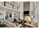 Open-concept living room with a cozy seating area and second story view at 4410 Miller Way, Westfield, IN 46062