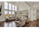 Sunlit living room with hardwood floors and views of the backyard at 4410 Miller Way, Westfield, IN 46062