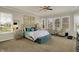 Tranquil main bedroom with a tufted headboard, a sitting area, neutral tones, and ample natural light at 4410 Miller Way, Westfield, IN 46062