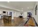 Basement recreation area featuring custom bar, theater seating, shuffleboard, and basketball at 4410 Miller Way, Westfield, IN 46062