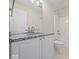 Bathroom featuring granite countertop, white cabinets, and a shower-tub combination at 45 Wisteria Way, Westfield, IN 46074
