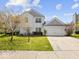 Charming two-story home with a well-manicured lawn, attached two-car garage and inviting curb appeal at 45 Wisteria Way, Westfield, IN 46074