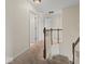 Hallway featuring carpeted floors and wooden railings at 45 Wisteria Way, Westfield, IN 46074