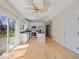 Open concept kitchen with an island, stainless steel appliances, and sliding doors to the backyard at 45 Wisteria Way, Westfield, IN 46074
