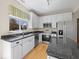 Bright kitchen with stainless steel appliances, granite countertops, and white cabinetry at 45 Wisteria Way, Westfield, IN 46074