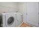 Well-lit laundry room featuring a modern washer and dryer set at 45 Wisteria Way, Westfield, IN 46074