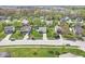 Residential neighborhood aerial view with well-maintained homes, mature trees, and green lawns under a sunny sky at 47 Thornburg Pkwy, Brownsburg, IN 46112