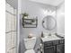 Bright bathroom with updated vanity, decor, and storage shelves at 47 Thornburg Pkwy, Brownsburg, IN 46112