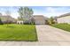 Single-story home featuring a brick and siding facade, well-maintained lawn, and an attached two-car garage at 47 Thornburg Pkwy, Brownsburg, IN 46112
