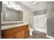 Bathroom featuring a wood vanity cabinet, granite countertops and a shower-tub at 4786 N Mill Ct, Greenfield, IN 46140