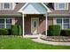 Close-up of the front door, showing brick facade and well-maintained landscaping at 4786 N Mill Ct, Greenfield, IN 46140