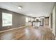 Open living room and kitchen featuring stainless steel appliances and wood-look floors at 4786 N Mill Ct, Greenfield, IN 46140