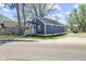 Street view of a charming blue home with manicured lawn, blending suburban charm and modern appeal at 507 Dr Martin Luther King Jr Blvd, Anderson, IN 46016