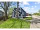 Attractive exterior view of a blue home highlighting its curb appeal and manicured lawn at 507 Dr Martin Luther King Jr Blvd, Anderson, IN 46016