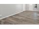 Bright living room featuring modern wood-look flooring and fresh neutral paint at 507 Dr Martin Luther King Jr Blvd, Anderson, IN 46016