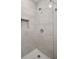 Shower featuring marble-look tiling and a built-in niche at 507 Dr Martin Luther King Jr Blvd, Anderson, IN 46016