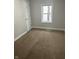 Bedroom with carpet flooring, fresh paint and a window overlooking the neighborhood at 517 W 26Th St, Indianapolis, IN 46208