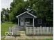 Charming home featuring a cozy front porch and fenced yard at 517 W 26Th St, Indianapolis, IN 46208