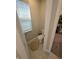 Small, well-lit half bathroom with a toilet and window at 5269 Parkhurst Xing, McCordsville, IN 46055