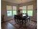 This dining area features a modern chandelier and a view of the back yard at 5269 Parkhurst Xing, McCordsville, IN 46055