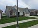 Welcoming home with a blue exterior, lush green lawn, and a convenient attached garage, ideal for families at 5269 Parkhurst Xing, McCordsville, IN 46055