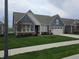 Stylish home exhibiting blue siding, a well-kept lawn, and an attached two-car garage for comfortable living at 5269 Parkhurst Xing, McCordsville, IN 46055