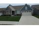 Charming two-story home featuring blue siding, a well-manicured lawn, and an attached two-car garage at 5269 Parkhurst Xing, McCordsville, IN 46055