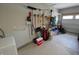 Well-organized garage with storage solutions, including wall-mounted tool racks and sports equipment at 5269 Parkhurst Xing, McCordsville, IN 46055