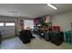Spacious garage with ample storage solutions, including shelving units and organized boxes at 5269 Parkhurst Xing, McCordsville, IN 46055