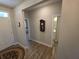 Hallway that leads into other rooms with wood flooring and decor at 5269 Parkhurst Xing, McCordsville, IN 46055