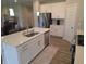 This bright kitchen features white cabinets, stone countertops, and stainless steel appliances at 5269 Parkhurst Xing, McCordsville, IN 46055