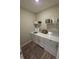 Bright laundry room with white cabinets, shelves, and modern washer and dryer units at 5269 Parkhurst Xing, McCordsville, IN 46055