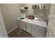 Bright laundry room with white cabinets, shelves, and modern washer and dryer units at 5269 Parkhurst Xing, McCordsville, IN 46055