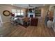 Bright living room with modern fireplace, ceiling fan, stylish decor, and wood flooring at 5269 Parkhurst Xing, McCordsville, IN 46055