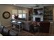 Cozy living room featuring a fireplace, wall shelves, decorative accents, and comfortable seating at 5269 Parkhurst Xing, McCordsville, IN 46055