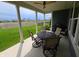 Covered patio with outdoor seating and a view of the manicured lawn and neighborhood at 5269 Parkhurst Xing, McCordsville, IN 46055
