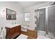 Bathroom with a modern vanity, walk-in shower, and wooden floors at 548 E 39Th St, Indianapolis, IN 46205