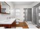 Bathroom boasting modern vanity, walk-in shower, and white walls at 548 E 39Th St, Indianapolis, IN 46205