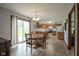 Bright dining area with sliding glass doors and hardwood floors at 5555 W Vermont St, Indianapolis, IN 46224