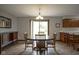 Inviting dining area with wood floors and an abundance of natural light at 5555 W Vermont St, Indianapolis, IN 46224