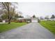 Charming brick ranch home with a long driveway and well-maintained lawn at 5555 W Vermont St, Indianapolis, IN 46224