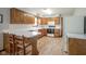 Well-lit kitchen featuring wood cabinets and plenty of counter space at 5555 W Vermont St, Indianapolis, IN 46224