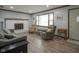 Comfortable living room featuring a large window and stylish furniture at 5555 W Vermont St, Indianapolis, IN 46224