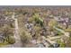 A wide-angle aerial view of the property in its neighborhood surroundings with tree coverage at 5954 Crestview Ave, Indianapolis, IN 46220