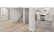 A basement kitchen features stainless steel appliances and leads to carpeted stairs at 5954 Crestview Ave, Indianapolis, IN 46220