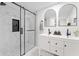 Modern bathroom featuring a double sink vanity, a marble shower, and a sleek design at 5954 Crestview Ave, Indianapolis, IN 46220